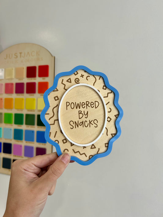 Powered by snacks sign